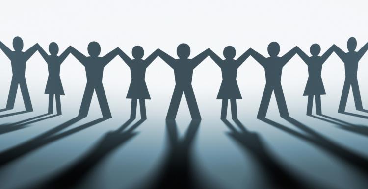 paperchain of people holding hands in a line