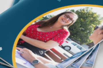 Photograph of copies of the Healthwatch annual report, Together we can. Two people chat and smile on the front cover. 