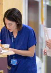 Hospital staff do paper work with a patient. 